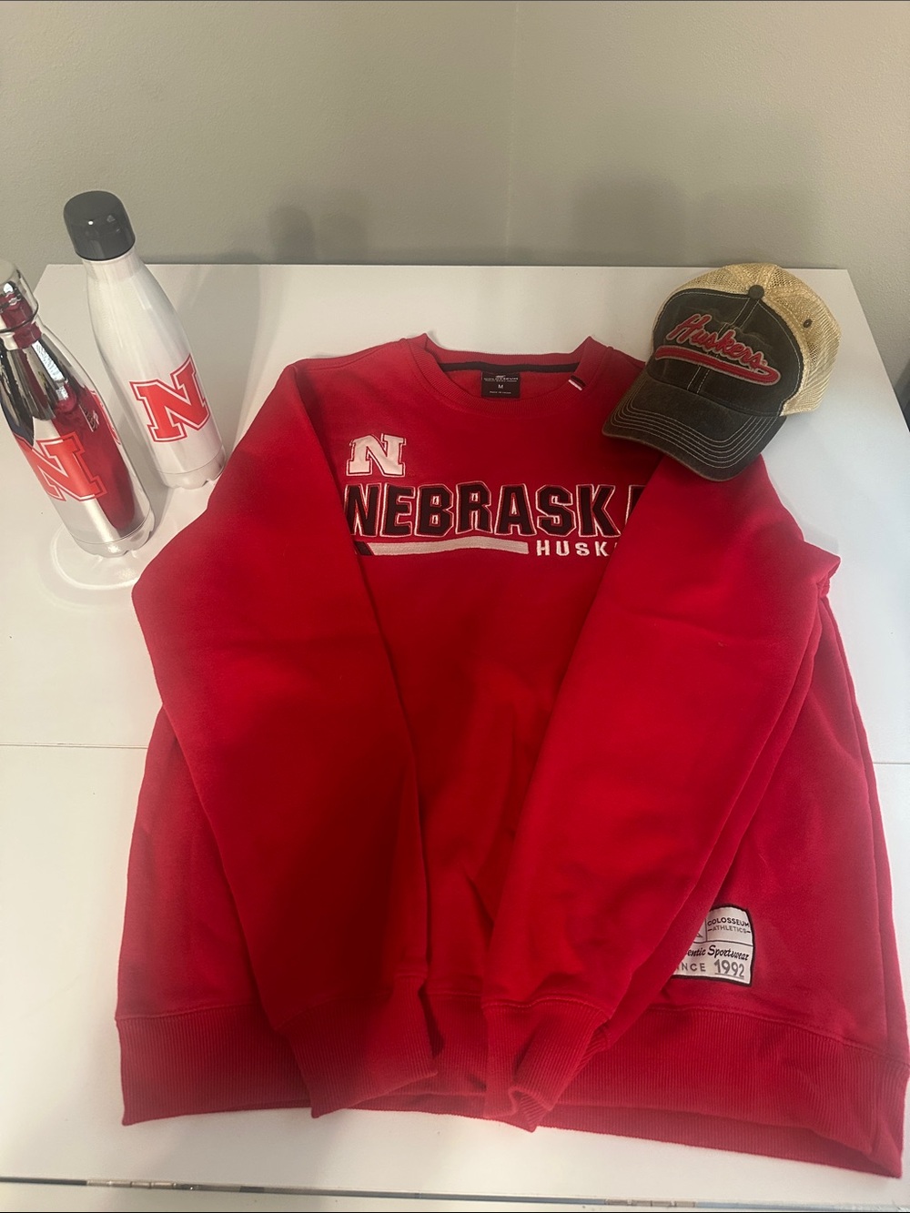 Set of Colosseum Red Nebraska Huskers Crewneck Sweatshirt, Huskers Hat, bottles